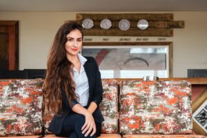 a woman sitting on a couch in a room